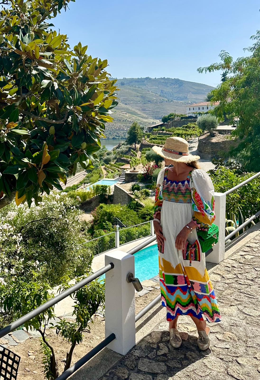Alexandra overlooking a terraced Douro valley landscape